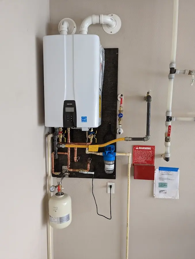 Professional plumber installing copper piping in a Fanwood home